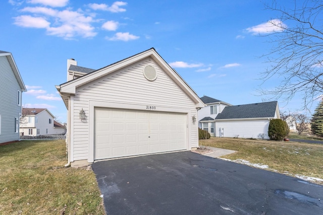 garage featuring driveway
