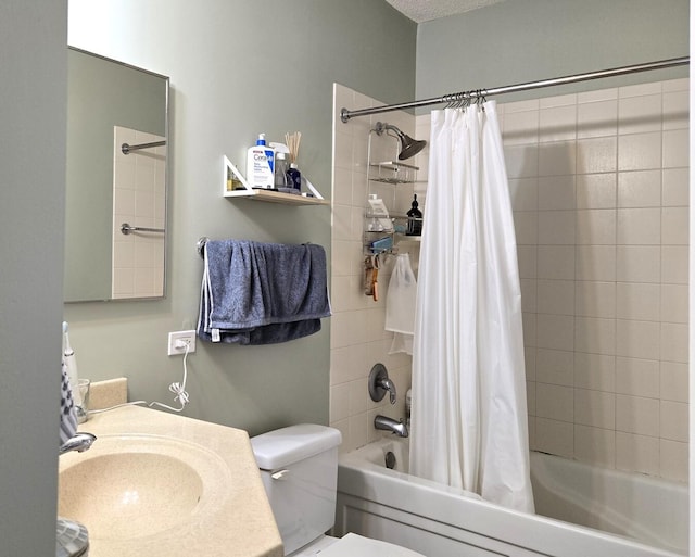 bathroom with shower / bath combo with shower curtain, a sink, and toilet