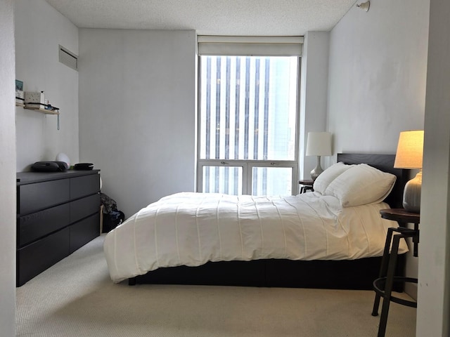 bedroom with carpet flooring and visible vents