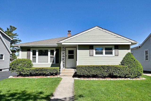 37 N Wisconsin Ave, Villa Park, IL 60181 - bungalow-style home featuring a front lawn and a chimney