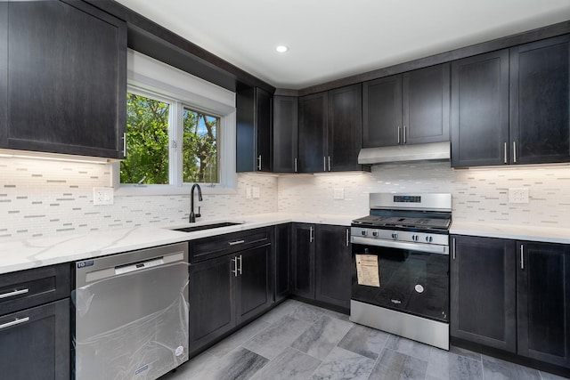 13001 S Westgate Dr, Palos Heights, IL 60463 - kitchen featuring stainless steel appliances, a sink, under cabinet range hood, backsplash, and dark cabinets