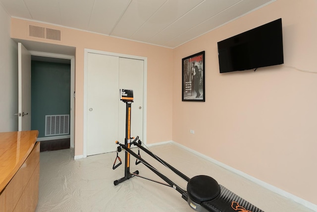2900 Maple Ave Unit 19E, Downers Grove, IL 60515 - workout room featuring baseboards, ornamental molding, light colored carpet, and visible vents