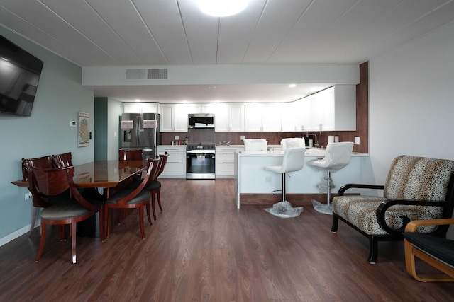 2900 Maple Ave Unit 19E, Downers Grove, IL 60515 - dining room with visible vents and dark wood finished floors
