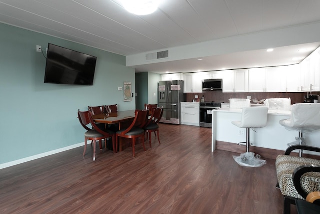 2900 Maple Ave Unit 19E, Downers Grove, IL 60515 - dining area with baseboards, visible vents, and dark wood-type flooring