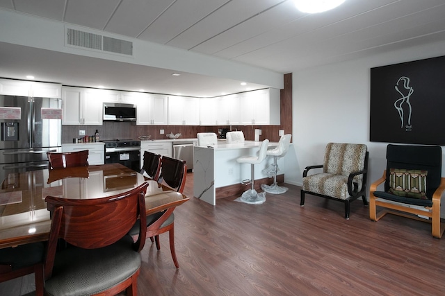 2900 Maple Ave Unit 19E, Downers Grove, IL 60515 - dining space featuring visible vents and dark wood-style floors