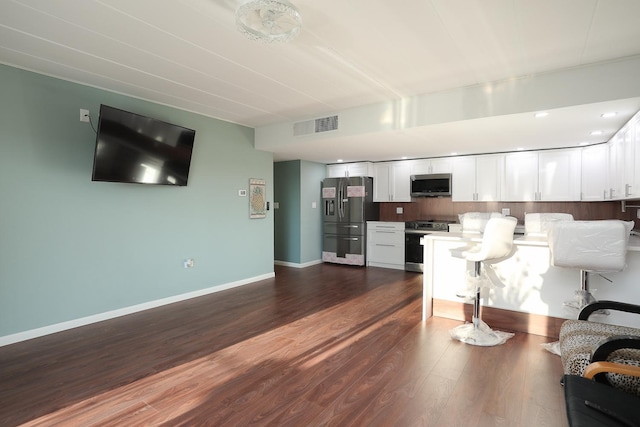 2900 Maple Ave Unit 19E, Downers Grove, IL 60515 - living room featuring baseboards, dark wood-style floors, and visible vents
