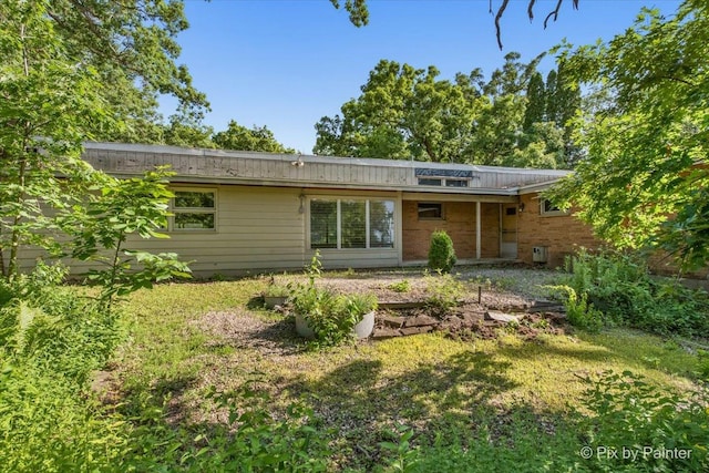 5010 Shady Oaks Ln, Crystal Lake, IL 60012 - back of property featuring brick siding and a lawn