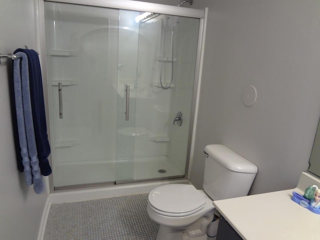 2013 Silverstone Dr Unit 2013, Carpentersville, IL 60110 - bathroom with vanity, toilet, baseboards, tile patterned floors, and a shower stall