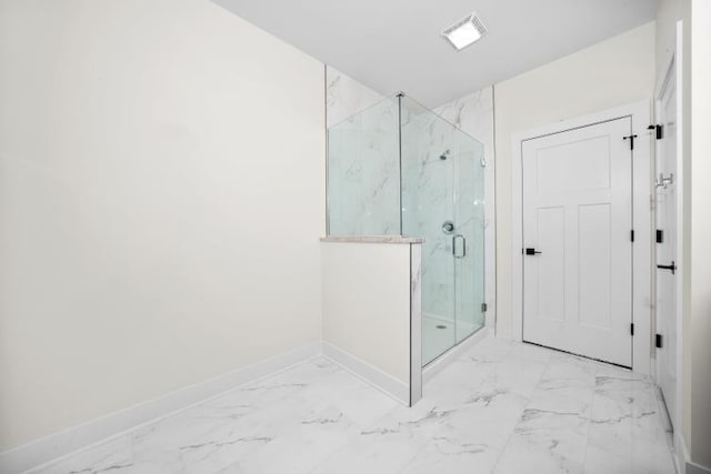 bathroom featuring a marble finish shower, baseboards, visible vents, and marble finish floor