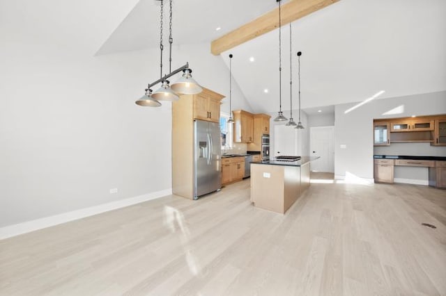 kitchen with dark countertops, appliances with stainless steel finishes, high vaulted ceiling, a kitchen island, and beamed ceiling