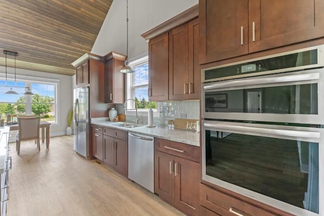 kitchen with light wood-type flooring, wooden ceiling, a sink, appliances with stainless steel finishes, and vaulted ceiling