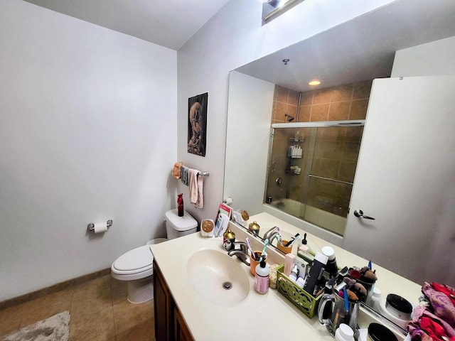 1255 S State St Unit 906, Chicago, IL 60605 - bathroom featuring toilet, vanity, tile patterned flooring, shower / bath combination with glass door, and baseboards