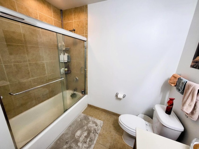 1255 S State St Unit 906, Chicago, IL 60605 - full bath with toilet, baseboards, tile patterned flooring, and bath / shower combo with glass door