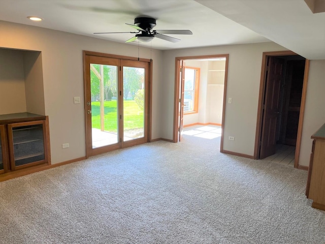 unfurnished living room with baseboards, carpet, a ceiling fan, and recessed lighting