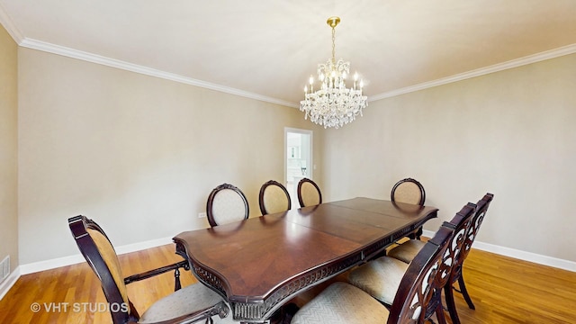 8980 N Enclave Dr, Burr Ridge, IL 60527 - dining space featuring a chandelier, wood finished floors, ornamental molding, and baseboards