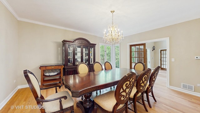 8980 N Enclave Dr, Burr Ridge, IL 60527 - dining space featuring a chandelier, light wood-style flooring, baseboards, and crown molding