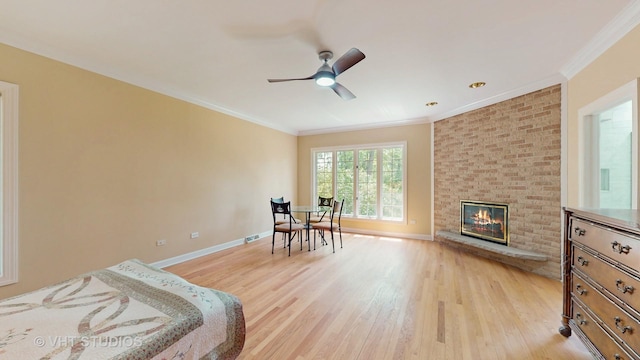 8980 N Enclave Dr, Burr Ridge, IL 60527 - bedroom featuring light wood-style flooring, ornamental molding, baseboards, a fireplace, and ceiling fan