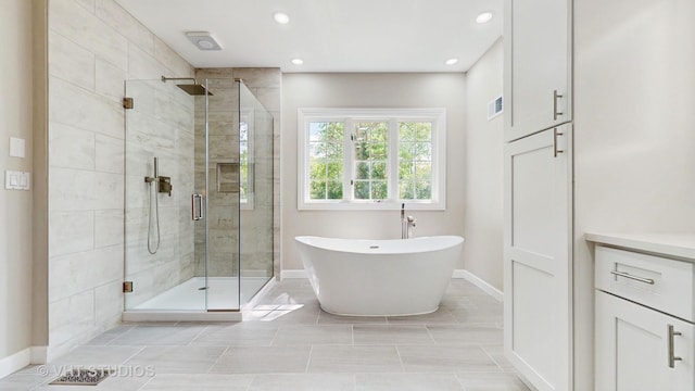 8980 N Enclave Dr, Burr Ridge, IL 60527 - full bathroom with a freestanding bath, a shower stall, baseboards, recessed lighting, and vanity