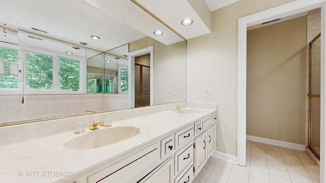 8980 N Enclave Dr, Burr Ridge, IL 60527 - full bathroom with double vanity, tile patterned floors, a shower stall, baseboards, and recessed lighting