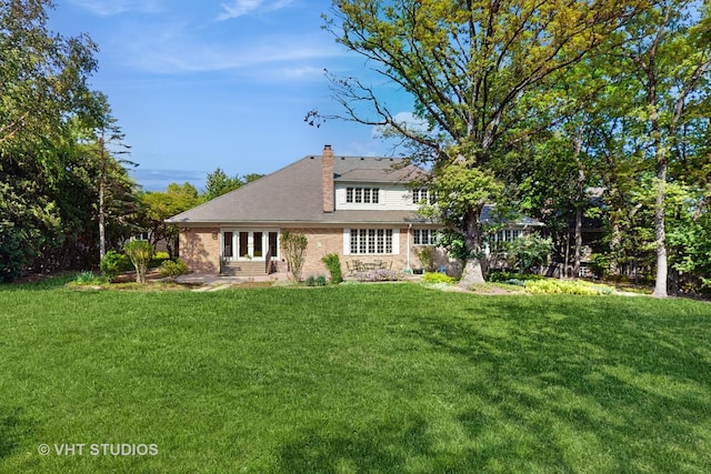 8980 N Enclave Dr, Burr Ridge, IL 60527 - rear view of house with a lawn, french doors, a chimney, and brick siding