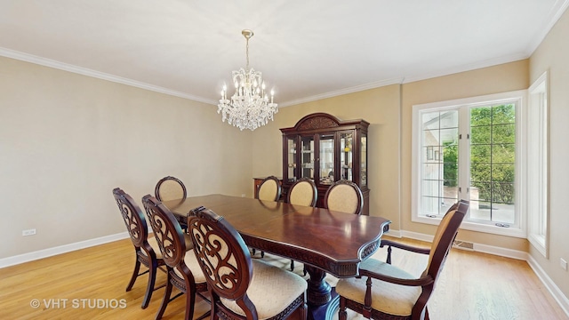 8980 N Enclave Dr, Burr Ridge, IL 60527 - dining room featuring a chandelier, light wood-type flooring, baseboards, and ornamental molding