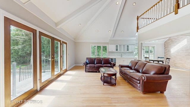 8980 N Enclave Dr, Burr Ridge, IL 60527 - living room featuring beamed ceiling, high vaulted ceiling, french doors, light wood finished floors, and beverage cooler