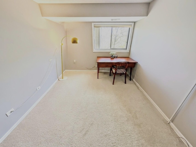 dining space with baseboards and carpet flooring