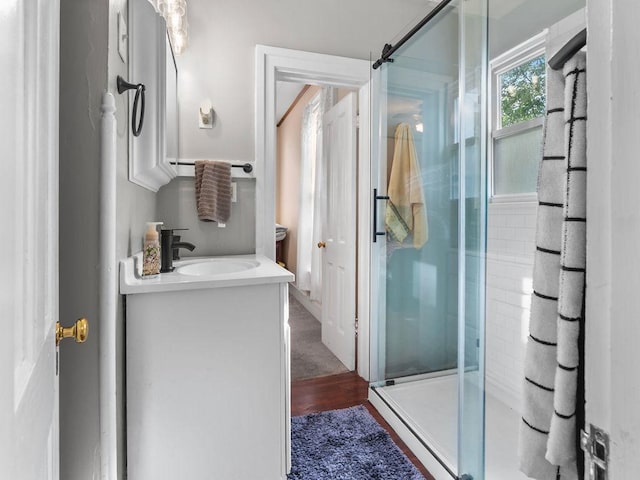 full bathroom featuring a shower stall and vanity