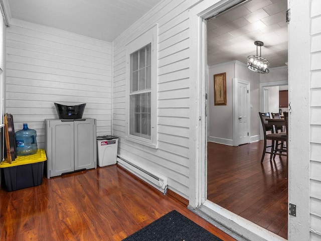property entrance featuring a baseboard radiator and covered porch
