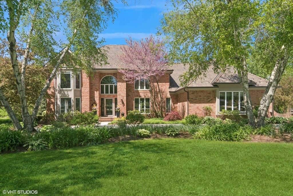 5632 Oakwood Cir, Long Grove, IL 60047 - view of front facade featuring a front lawn and brick siding