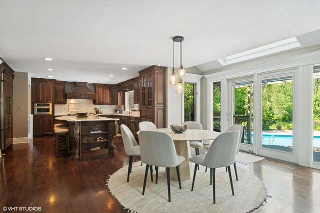 5632 Oakwood Cir, Long Grove, IL 60047 - dining space featuring dark wood-style flooring, a skylight, and recessed lighting