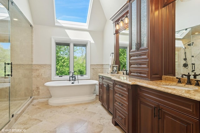 5632 Oakwood Cir, Long Grove, IL 60047 - full bathroom featuring a stall shower, tile walls, double vanity, lofted ceiling, and a soaking tub