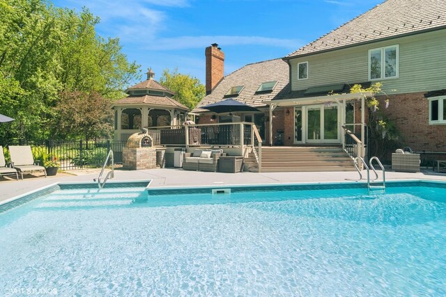 5632 Oakwood Cir, Long Grove, IL 60047 - view of pool with a gazebo, fence, an outdoor living space, a patio, and exterior kitchen