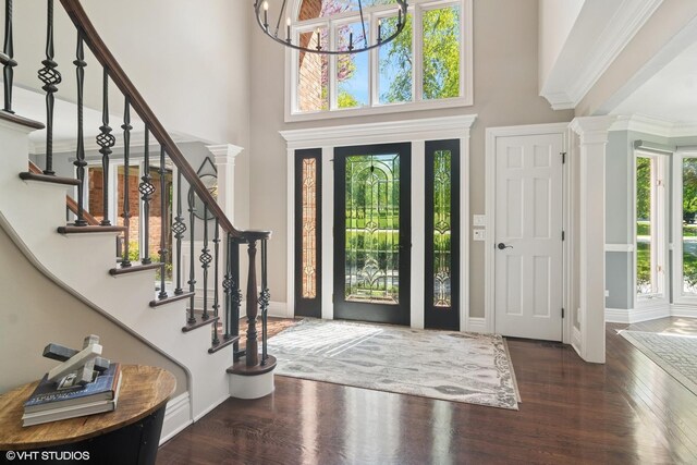5632 Oakwood Cir, Long Grove, IL 60047 - entryway with healthy amount of natural light, ornate columns, a towering ceiling, wood finished floors, and stairs