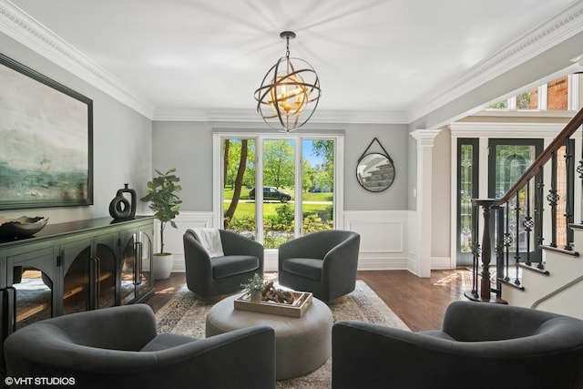 5632 Oakwood Cir, Long Grove, IL 60047 - living room featuring plenty of natural light, wood finished floors, stairs, a chandelier, and a wainscoted wall