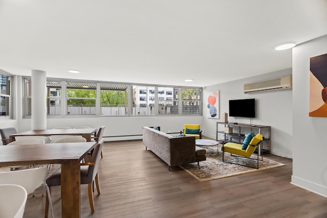 living area featuring a wall mounted air conditioner, wood finished floors, baseboards, plenty of natural light, and recessed lighting