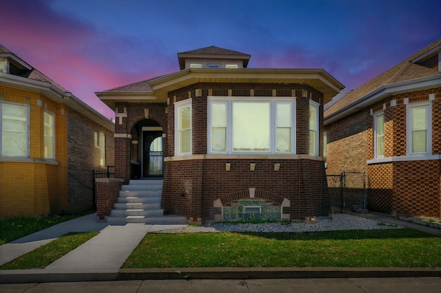 view of front of house featuring fence and brick siding