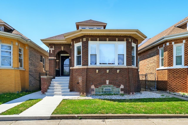 view of front facade with brick siding and fence
