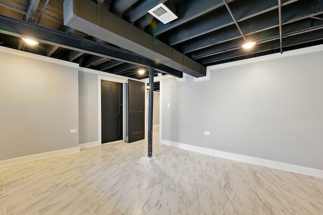 finished basement with visible vents and baseboards