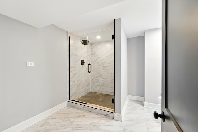 bathroom featuring a stall shower, recessed lighting, baseboards, marble finish floor, and toilet