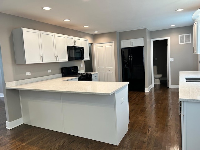 607 W Maude Ave, Arlington Heights, IL 60004 - kitchen with black appliances, a peninsula, dark wood-type flooring, baseboards, and recessed lighting