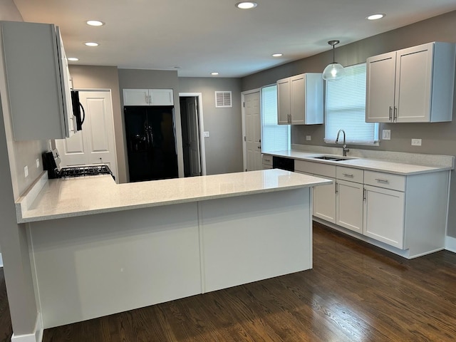 607 W Maude Ave, Arlington Heights, IL 60004 - kitchen with black appliances, a sink, a peninsula, dark wood-style flooring, and recessed lighting