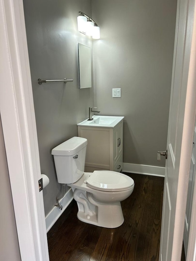 607 W Maude Ave, Arlington Heights, IL 60004 - bathroom with wood finished floors, toilet, baseboards, and vanity