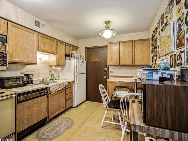 9622 Bianco Ter Unit D, Des Plaines, IL 60016 - kitchen featuring freestanding refrigerator, wallpapered walls, decorative backsplash, stove, and dishwasher