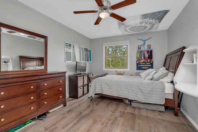 bedroom featuring a ceiling fan and light wood-type flooring
