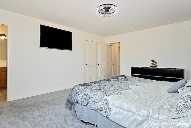 carpeted bedroom featuring baseboards