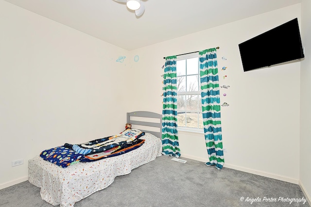 bedroom with carpet floors, baseboards, and visible vents
