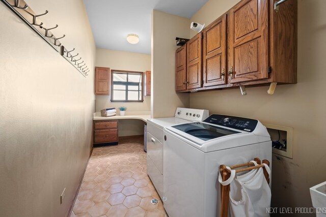 clothes washing area featuring cabinet space, separate washer and dryer, and light tile patterned floors