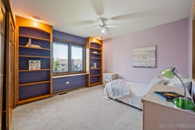 carpeted bedroom featuring ceiling fan