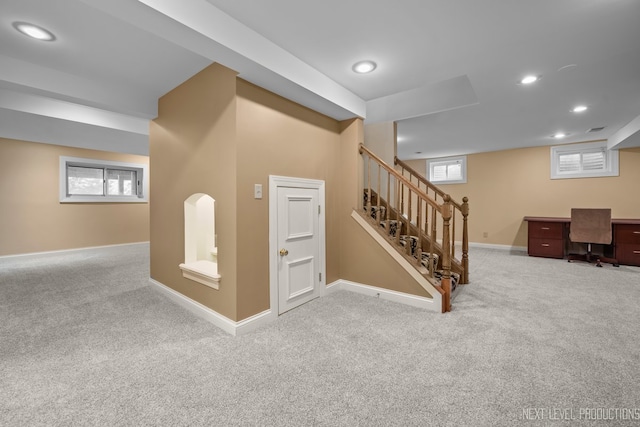 basement featuring carpet floors, baseboards, recessed lighting, and stairs